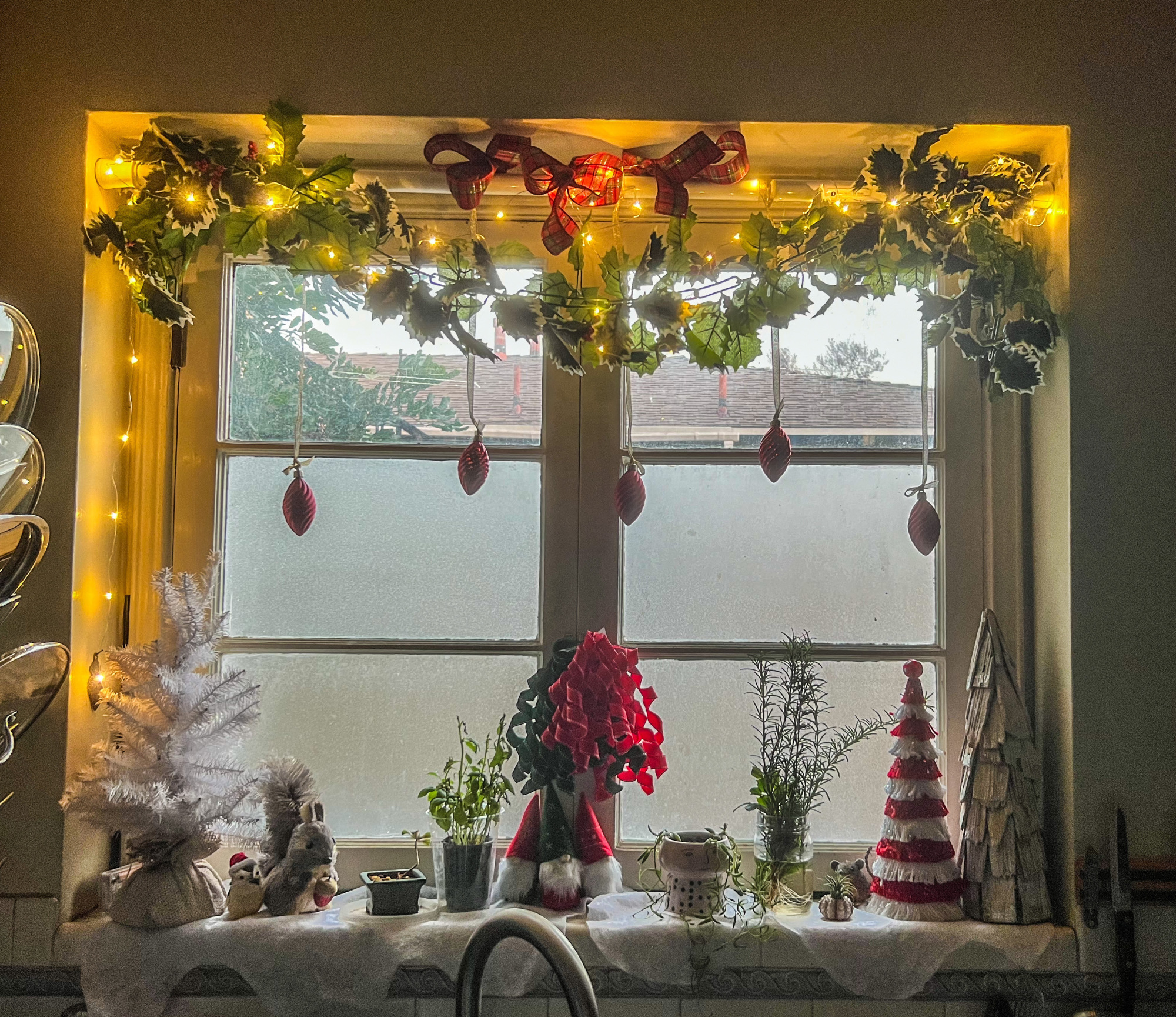 A window decorated for Christmas